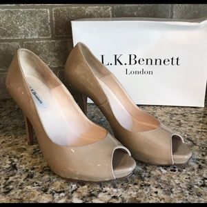 Peep toe, patent leather high heel shoes.